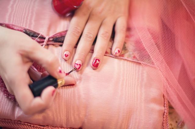 Manicure with hearts painted on nails