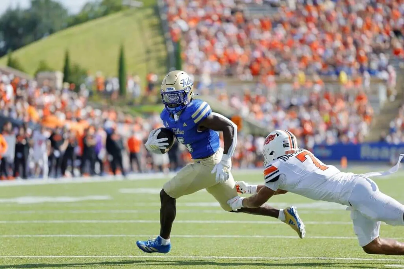 Running back Damari Alston of Tulsa Golden Hurricane scores a touchdown.