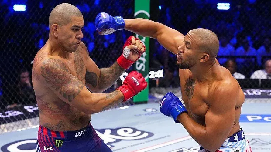 Alex Pereira is punched by Ciryl Gane in their UFC fight