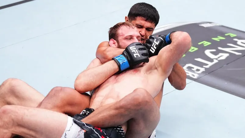 Nursulton Ruziboev of Uzbekistan secures a rear choke submission against Andrey Pulyaev of Russia in a middleweight fight during the UFC Fight Night event at National Gymnastics Arena on June 27, 2026 in Baku, Azerbaijan. (Photo by Jeff Bottari/Zuffa LLC)