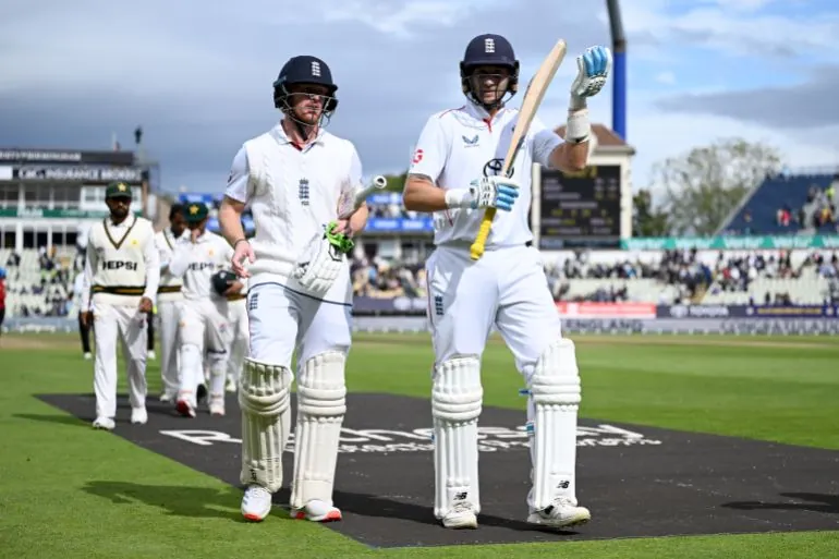 BIRMINGHAM, ENGLAND - SEPTEMBER 12: Jordan Cox and Joe Root of England leave the field after winning the 3rd Rothesay Test Match between England and Pakistan at Edgbaston on September 12, 2026 in Birmingham, England. (Photo by Gareth Copley/Getty Images)